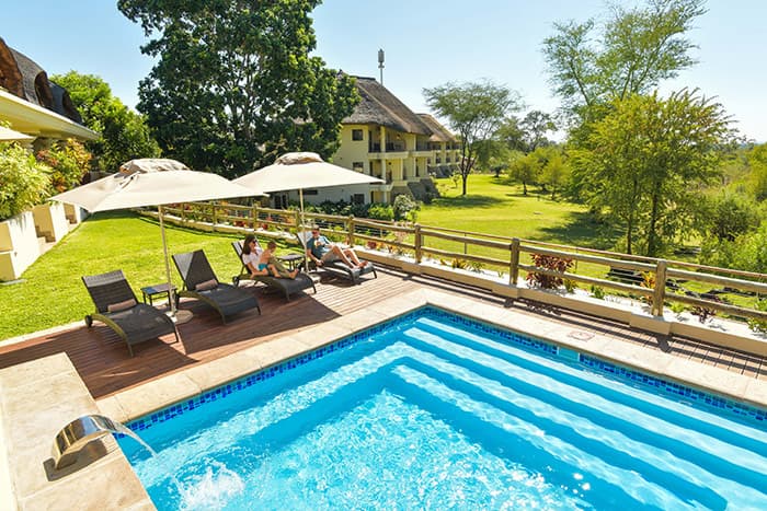 Family relaxing at pool